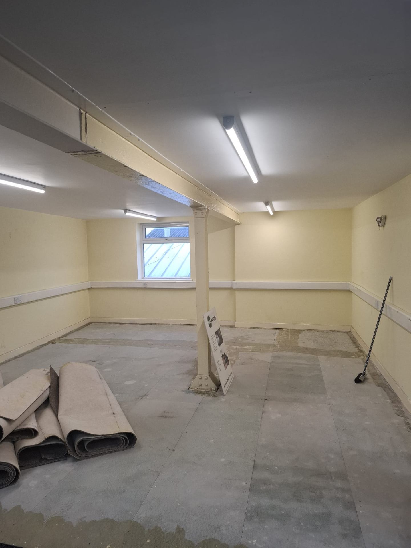 Interior of the Synergy Building Sheffield prior to refurbishment, showing structural steel beam and column