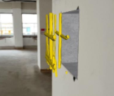Augmented reality overlay showing embedded reinforcement projected onto a concrete column on site